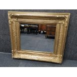 A large gilt framed bevelled glass mirror, 92 x 82cm.