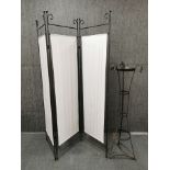 A wrought iron and fabric three fold screen, H. 182, together with a wrought iron plant/ ice