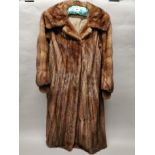 A vintage ladies' full length dark pastel mink female skins coat, L. 106cm, accompanied by a 1986