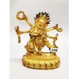 A Tibetan gilt bronze figure of the guardian deity Mahakala, H. 24cm.