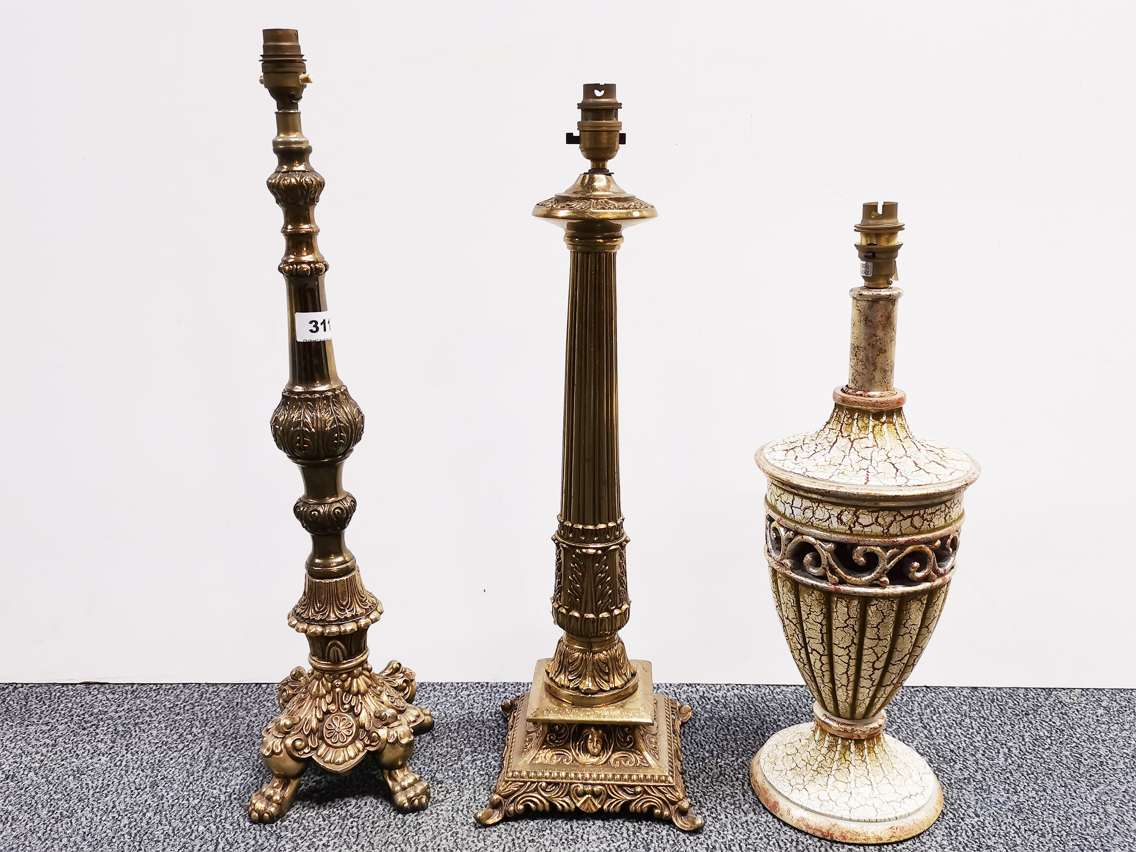 Two gilt brass table lamps and a further crackle glazed lamp, tallest H. 58cm.