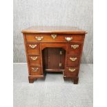 An early mahogany kneehole desk/ gentleman's dressing table, 74 x 52 x 76cm.