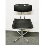 An upholstered swivel desk chair.