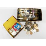 A tin of mixed coins.