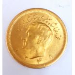 An Iranian gold 1 Pahlavi coin, c. 1960s, approx. 8.1gr.