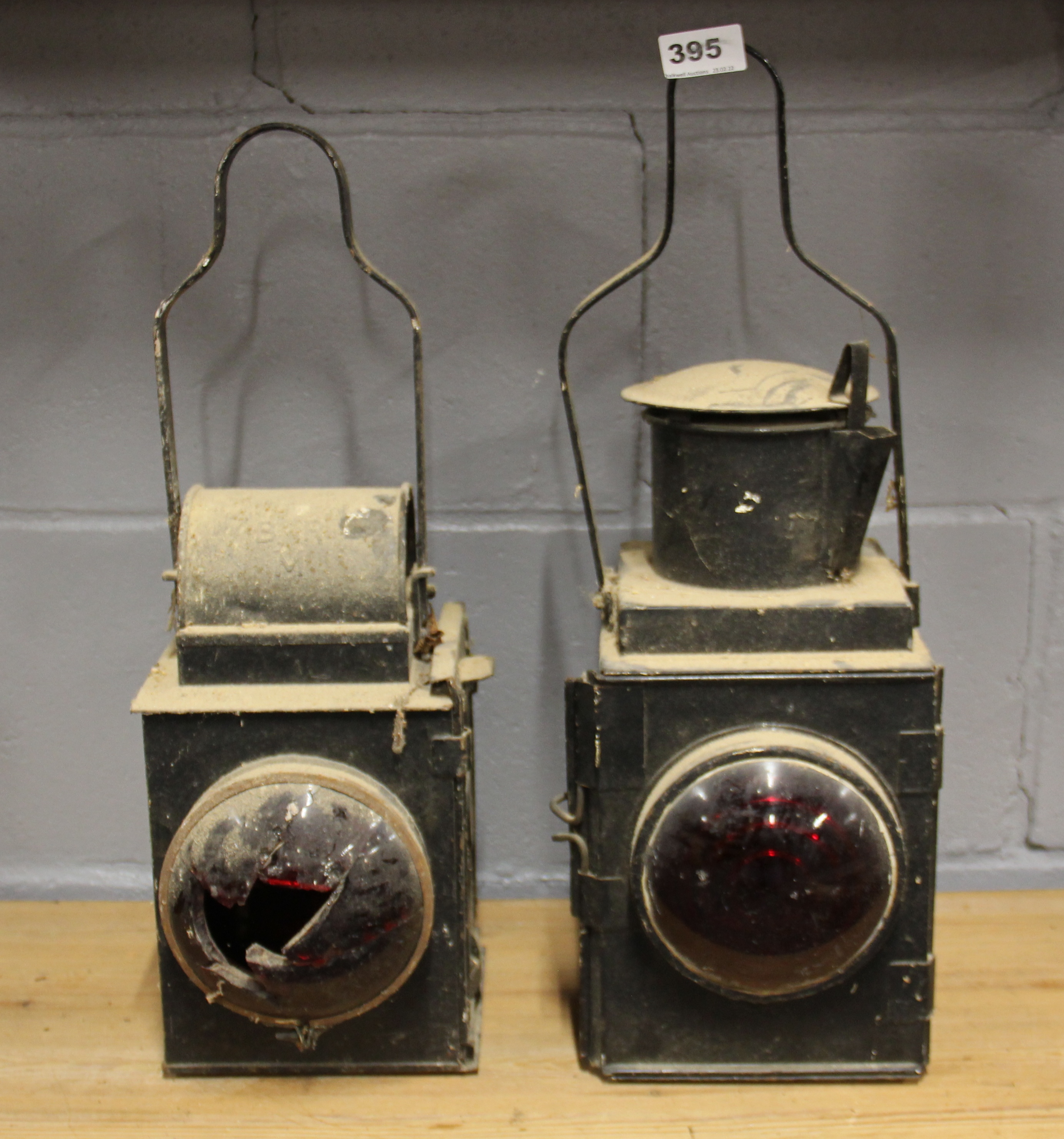 Two early railway signalling lamps, H. 52cm.