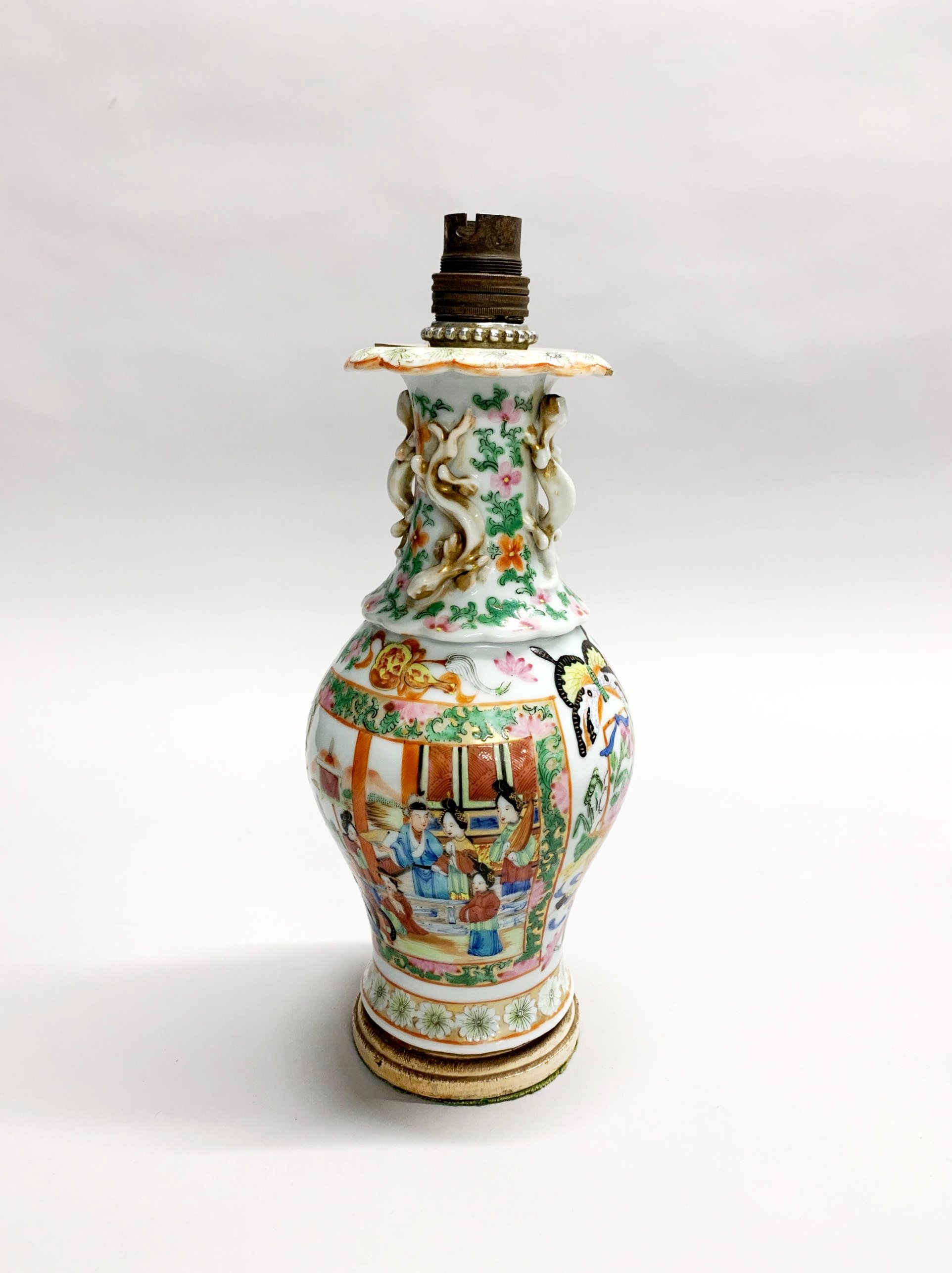 A 19th century Chinese Canton enamelled porcelain vase mounted on a wooden base as a table lamp,