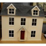 A large wooden doll's house, 71 x 59cm.