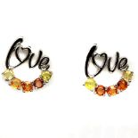 A pair of 925 silver "Love" earrings set with fancy orange and yellow sapphires, L. 2cm.