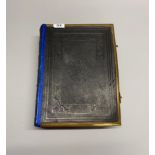 A brass mounted and leather bound volume of the Holy Bible.