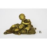 A small 19th century gilt bronze figure of a child with a cat (probably a paperweight), 15 x 8.5cm.