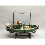 A handmade model of a fishing boat, L. 56cm.