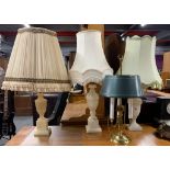 Three polished onyx table lamps and a desk lamp.