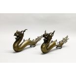 A pair of early 20th century Chinese bronze water dragons, L. 33cm. Both slightly A/F to tails.