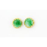 A pair of yellow metal (tested high carat gold) stud earrings set with polished jade, Dia. 0.7cm, (