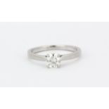 An 18ct white gold solitaire ring set with a brilliant cut diamond, approx. 0.55ct, (M).
