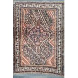 An early 20th century handwoven Persian wool rug, 113 x 145cm.