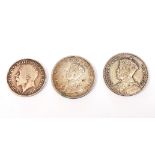 Three George V coins: a New Zealand half crown, c. 1933, a South Africa 2 1/2 shillings c. 1924