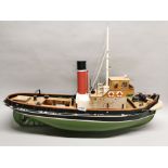 A handmade wooden working model of a tug, L. 87cm.