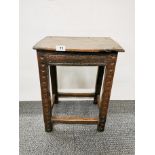 An 18th century carved oak joint stool with initials IB carved to one end, 39 x 26 x 50cm.