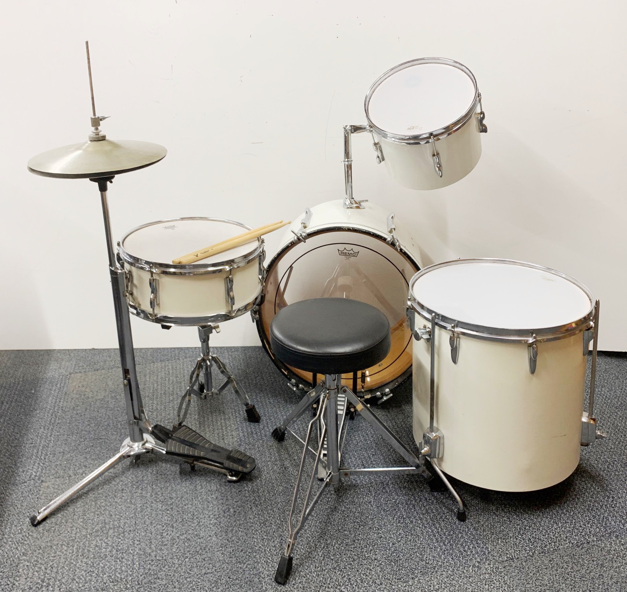 A 1960's Remo cherrywood drum kit.