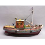 A handmade wooden working model of a fishing boat, L. 54cm.
