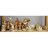 A group of North American Native figures and Lilliput Lane cottages.