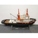 A large handmade wooden working model of the Tug boat Amsterdam, L. 100cm.