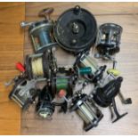 A group of fishing reels.