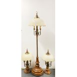 An impressive Dutch style walnut and brass standard lamp and two matching table lamps. Standard lamp