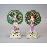 A pair of 19th century Chelsea style porcelain figures, H. 18cm (slightly A/F).