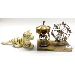 A mechanical musical metal model of a fairground, together with a vintage soft tiger toy, fairground