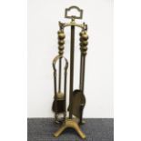 A vintage brass fireside companion set, H. 57cm.