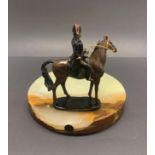 A signed V.R.A.I cold painted Bronze figure of Napoleon riding a horse (after A. Canova) mounted