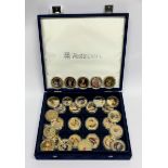 A box of gold plated commemorative coins.