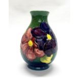 A Moorcroft hibiscus pattern vase, H. 21cm.