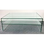 A very heavy contemporary plate glass coffee table, 110 x 60 x 40cm.