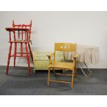 A painted wooden child's high chair with a folding metal crib, doll's cot and folding child's