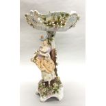 A 19th century porcelain figural centrepiece, H. 46cm. (repair to top).