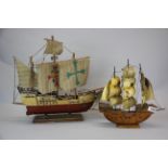 A 1930's carved wood and horn Galleon, H. 32cm, together with a wooden model of the Santa Maria,