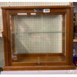 A useful glass display cabinet, 46 x 24 x 40cm.