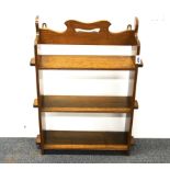 A light oak wall mounted shelf unit, H. 66, W. 50cm.