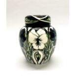 A boxed Moorcroft 'Harlequinade' design ginger jar with lid, H. 17cm.