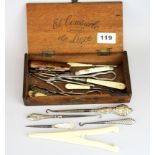 A box of interesting button hooks and glove stretchers.
