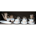 A Poole pottery coffee set, tea and coffee pot lids missing.