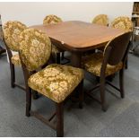 A 1930's oak draw leaf dining table and six upholstered chairs, 99 x 122cm, opening to 162cm.