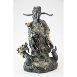 A Chinese bronze figure of a lucky god and a dragon with gilt splash decoration, H. 40cm.