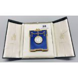 A boxed Kitney and Co London gilt metal clock, H. 9cm, L. with box 16cm.