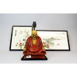 Two framed embroidered Oriental silks, together with a Nirvana Ware composition figural table lamp