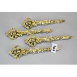 A set of four silver gilt cherub furniture decorations, L. 21.5cm with indistinct (possibly